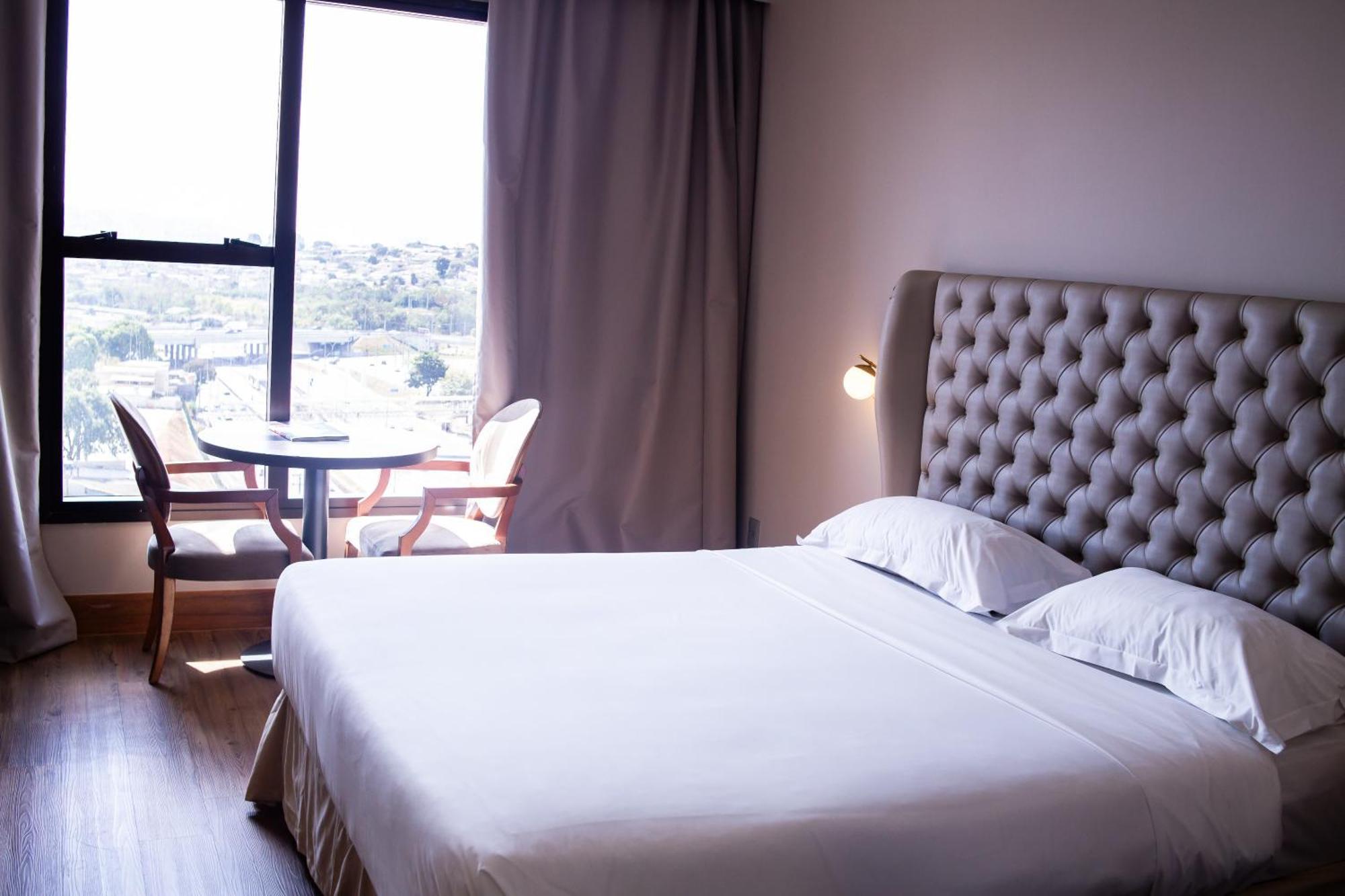 Ouro Minas Hotel Belo Horizonte, Dolce By Wyndham Exteriér fotografie A bedroom at the hotel